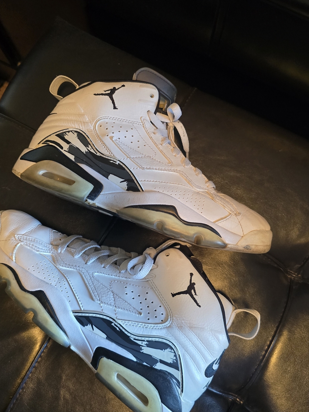 Nike Jordan's White and Black High-Top Basketball Shoes